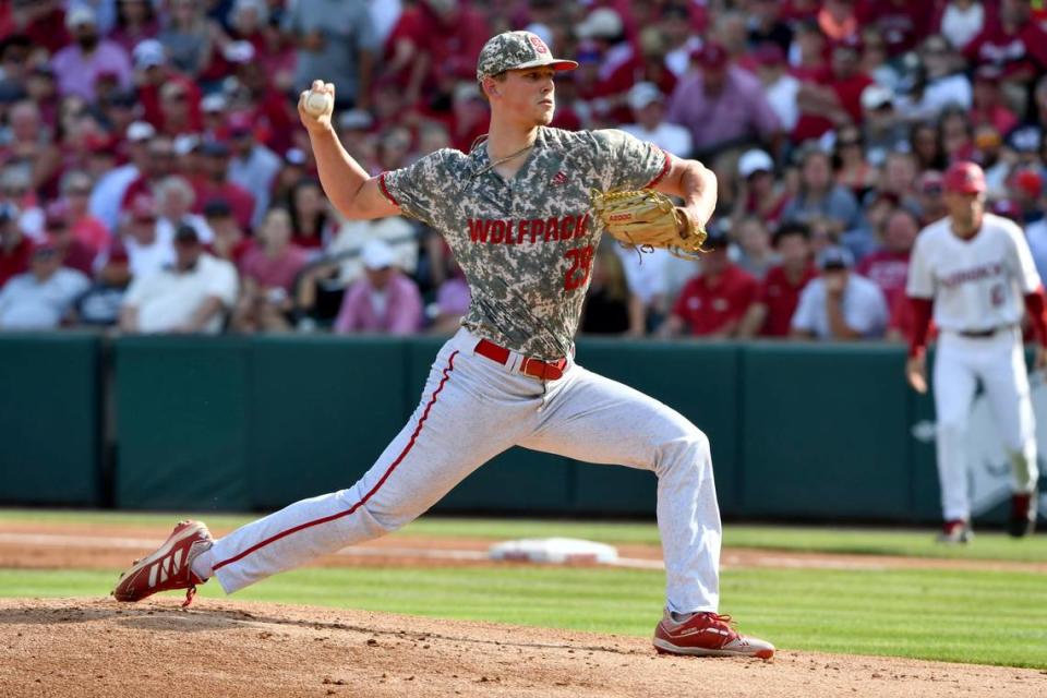 North Carolina State pitcher Reid Johnston (29) throws a pitch against Arkansas in the first inning of an NCAA college baseball super regional game Friday, June 11, 2021, in Fayetteville, Ark. (AP Photo/Michael Woods)