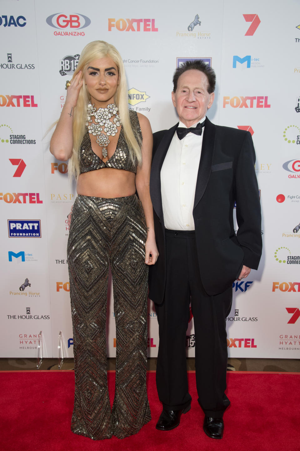  Geoffrey Edelsten and Gabi Grecko arrive ahead of the Red Ball 2015 at the Grand Hyatt on September 5, 2015 in Melbourne