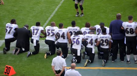 Sep 24, 2017; London, United Kingdom; Baltimore Ravens players kneel during the playing of the Untied States national anthem before a NFL International Series game against the Jacksonville Jaguars at Wembley Stadium. Mandatory Credit: Kirby Lee-USA TODAY Sports