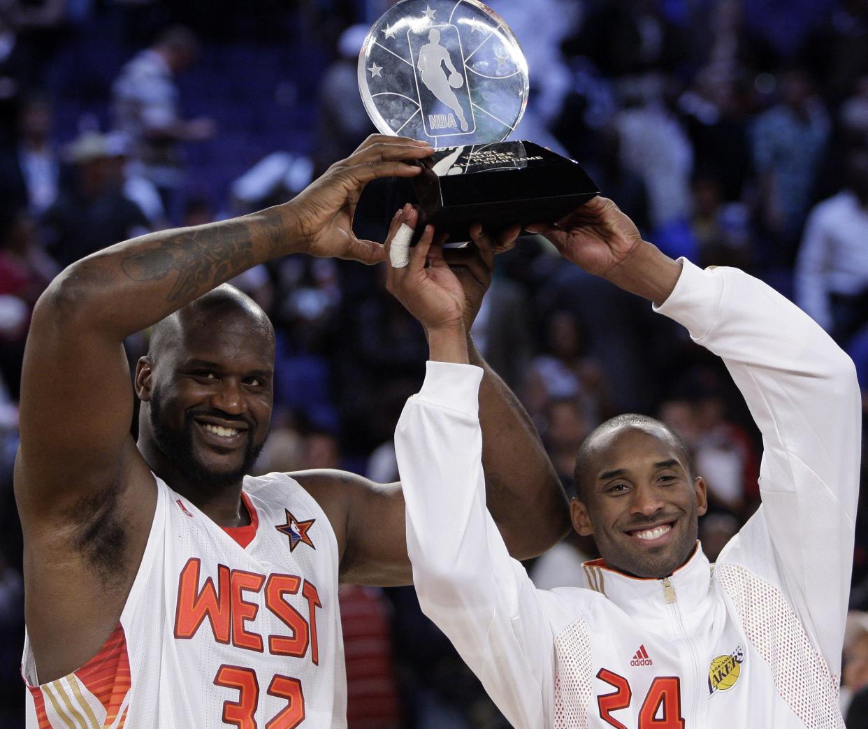 Western All-Star Shaquille O'Neal (32) of the Phoenix Suns and Western All-Star Kobe Bryant (24) of the Los Angeles Lakers share the MVP award from the NBA All-Star basketball game Sunday, Feb. 15, 2009, in Phoenix.