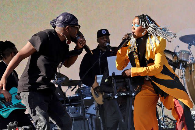 <p>Arturo Holmes/Getty Images</p> Wyclef Jean and Lauryn Hill perform at Coachella Weekend 1 on April 14, 2024 in Indio, California