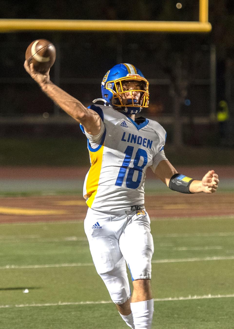 Linden's Dax Weber (18) throws a pass during a varsity football game at Edison's Magnasco Stadium in Stockton on Friday, Oct. 14, 2022.