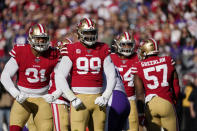 San Francisco 49ers defensive end Arik Armstead, left, and defensive tackle DeForest Buckner (99) react to a play against the Minnesota Vikings during the first half of an NFL divisional playoff football game, Saturday, Jan. 11, 2020, in Santa Clara, Calif. (AP Photo/Tony Avelar)