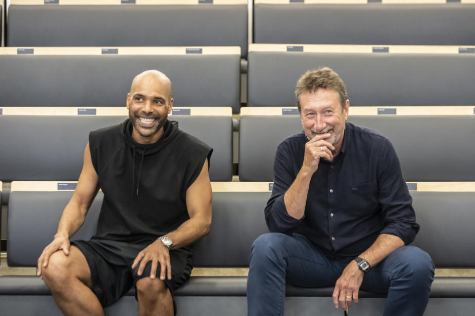 This image released by Rambert Dance shows Rambert Artistic Director Benoit Swan Pouffer, left, and Steven Knight, writer and creator of the series "Peaky Blinders," during a rehearsal of the dance production "Peaky Blinders: The Redemption of Thomas Shelby," in London, England. (Johan Persson/Rambert Dance via AP)
