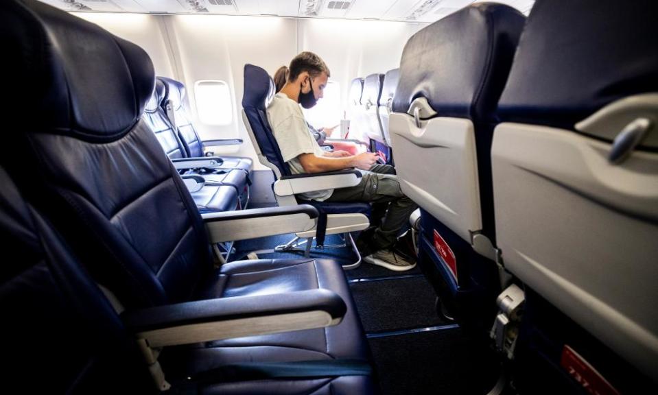 A Southwest passenger waits for takeoff in Oakland, California. Nearly 30% of airline employees have taken voluntary retirement or extended leave.