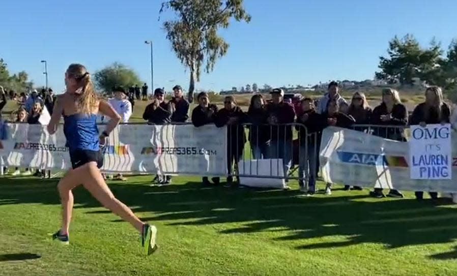 Valley Christian's Lauren Ping heads for the finish line as fans cheer her on. Ping won her fourth consecutive state indivdiual girls cross country championship on Saturday, Nov. 12, 2022.