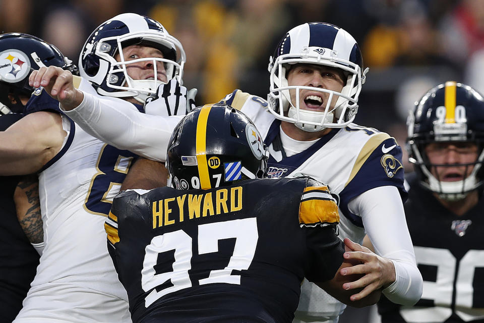 Los Angeles Rams quarterback Jared Goff (16) is hit by Pittsburgh Steelers defensive end Cameron Heyward (97) after getting off a pass during the first half of an NFL football game in Pittsburgh, Sunday, Nov. 10, 2019. (AP Photo/Keith Srakocic)