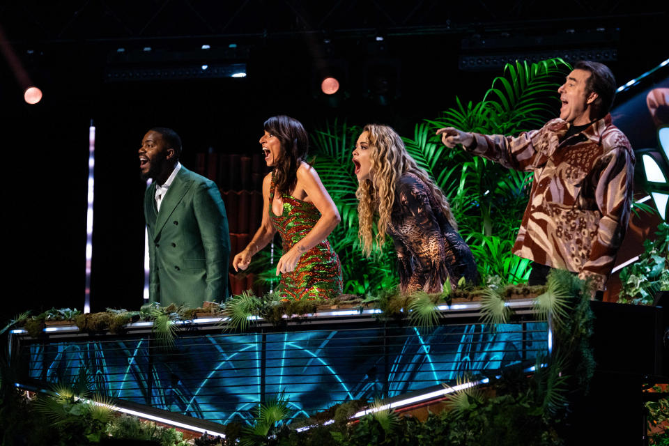 Mo Gilligan, Davina McCall, Rita Ora and Jonathan Ross stand behind the judges desk