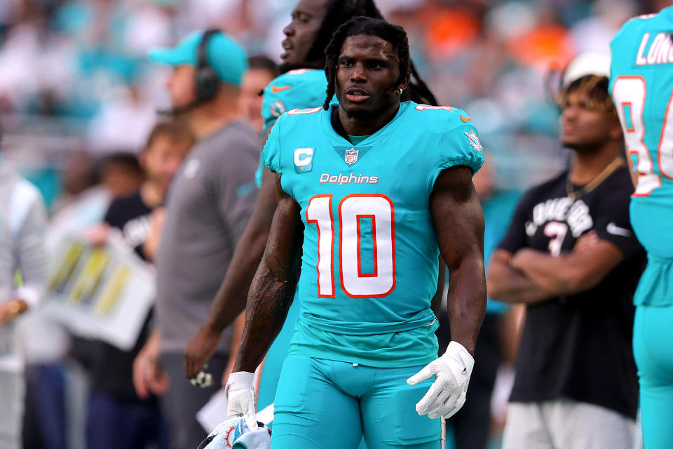 MIAMI GARDENS, FLORIDA - JANUARY 08: Tyreek Hill #10 of the Miami Dolphins looks on from the sidelines against the New York Jets during the second half of the game at Hard Rock Stadium on January 08, 2023 in Miami Gardens, Florida. (Photo by Megan Briggs/Getty Images)