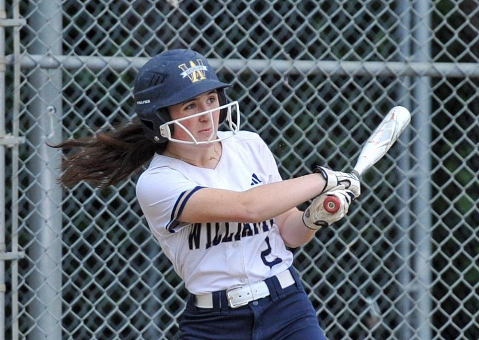 Archbishop Williams' Alyssa Burke watches the flight of her hit against Wahconah during girls softball in Braintree, Thursday, June 8, 2023. Tom Gorman/For The Patriot Ledger