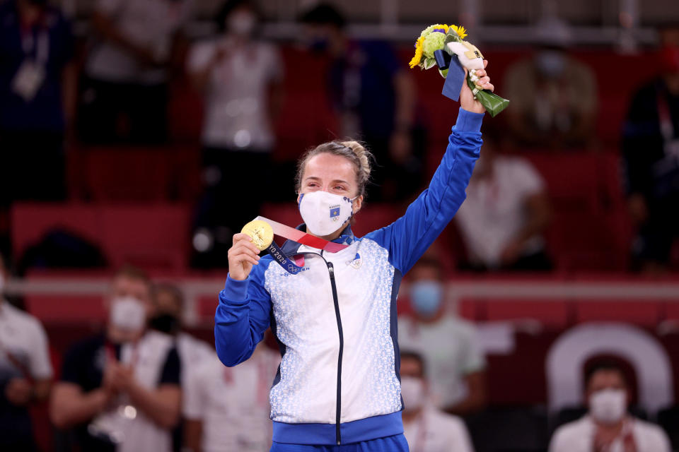 Distria Krasniqi of Team Kosovo poses with the gold medal