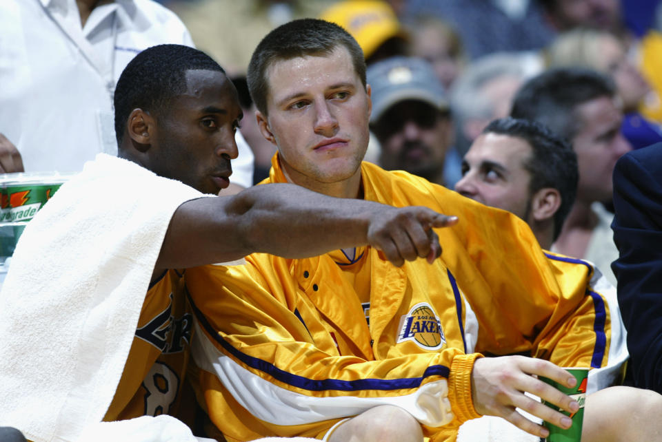 FILE -- Kobe Bryant talks to Slava Medvedenko of the Los Angeles Lakers during the NBA season opener against the San Antonio Spurs at Staples Center on October 29, 2002, in Los Angeles, California.  / Credit: Getty Images