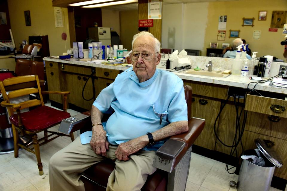 Bob Keller sits in one of the "new" chairs he bought in 1967 for Keller's Barbershop in Bucyrus.
