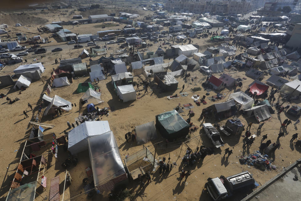 Palestinians displaced by the Israeli bombardment of the Gaza Strip set up a tent camp in Rafah on Wednesday, Dec. 6, 2023. (AP Photo/Hatem Ali)