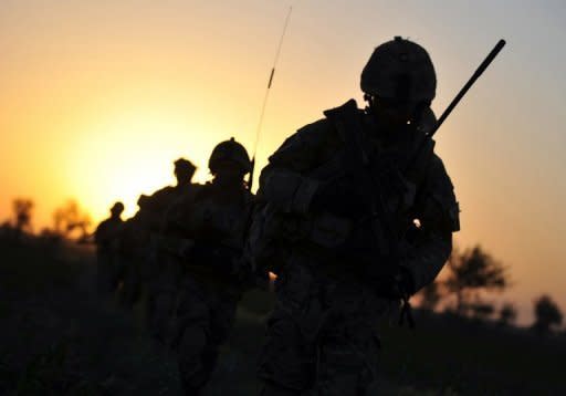 British soldiers patrol the Nahr-e-Saraj dstrict of Helmand province in June 2010. An Afghan police officer has killed three British soldiers serving with NATO in Afghanistan's troubled south, the latest in a series of escalating "green on blue" attacks in the decade-long war