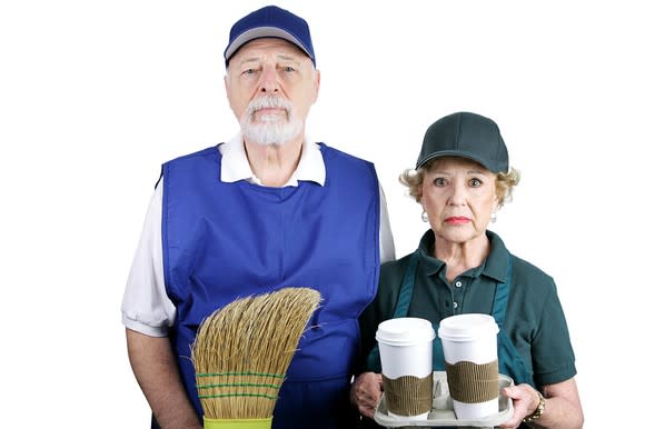 Older man with a broom, and woman holding coffee cups, with unhappy expressions.