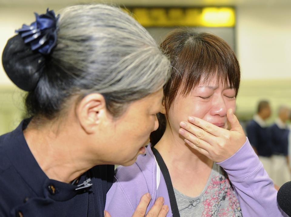 A relative of a passenger on board the crashed TransAsia Airways plane cries in Kaohsiung International Airport, southern Taiwan, July 23, 2014. A TransAsia Airways turboprop ATR-72 plane crashed on its second attempt at landing during a thunderstorm on Penghu, an island off Taiwan on Wednesday, killing 47 people and setting buildings on fire, officials said. (REUTERS/Stringer)