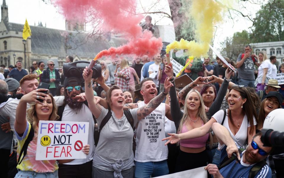 Demonstrators participate in an anti-lockdown and anti-vaccine protest in central London -  REUTERS/Henry Nicholls