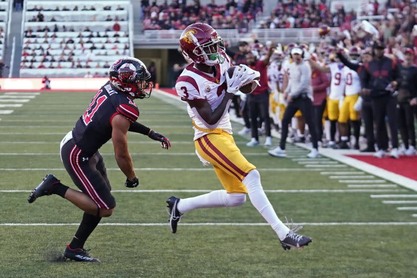 Southern California wide receiver Jordan Addison (3) scores a touchdown against Utah safety R.J. Hubert