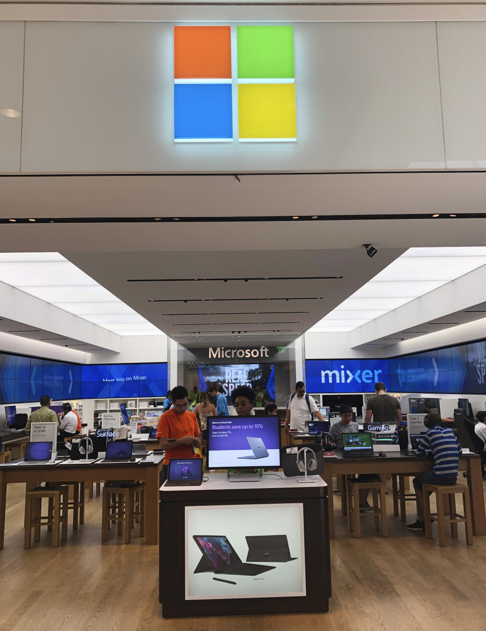 In this July 11, 2019 photo, a Microsoft store is shown in Aventura, Fla. Microsoft Corp. reports earnings Thursday, July 18, 2019. (AP Photo/Wilfredo Lee)