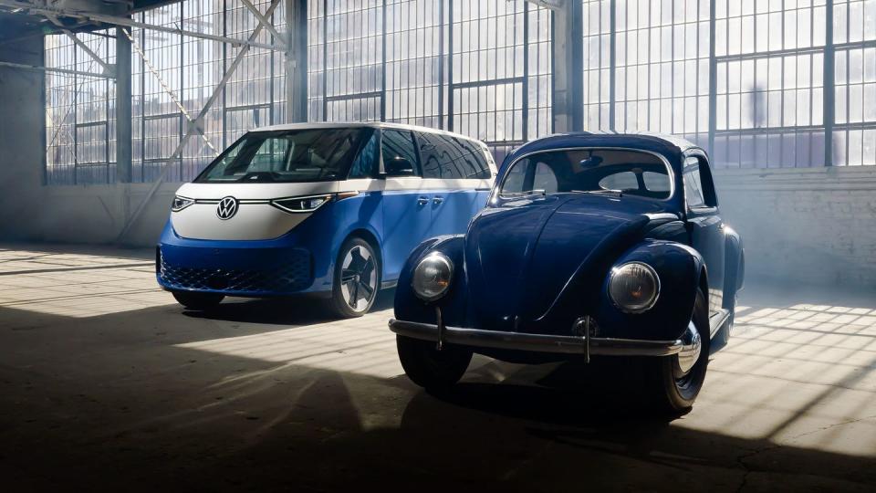 vw beetle and id buzz in a dark warehouse