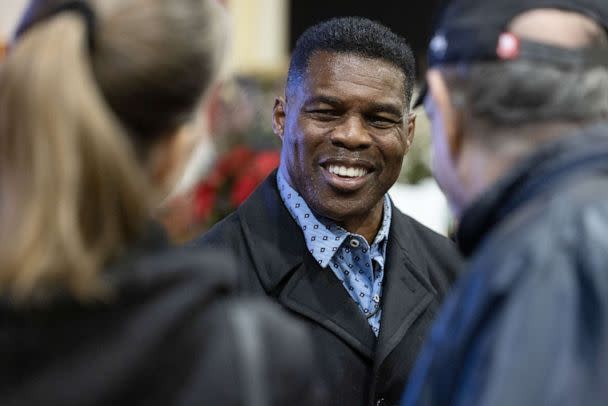 PHOTO: Senate nominee Herschel Walker talks with supporters during a rally, Nov. 21, 2022 in Milton, Georgia. (Jessica Mcgowan/Getty Images)