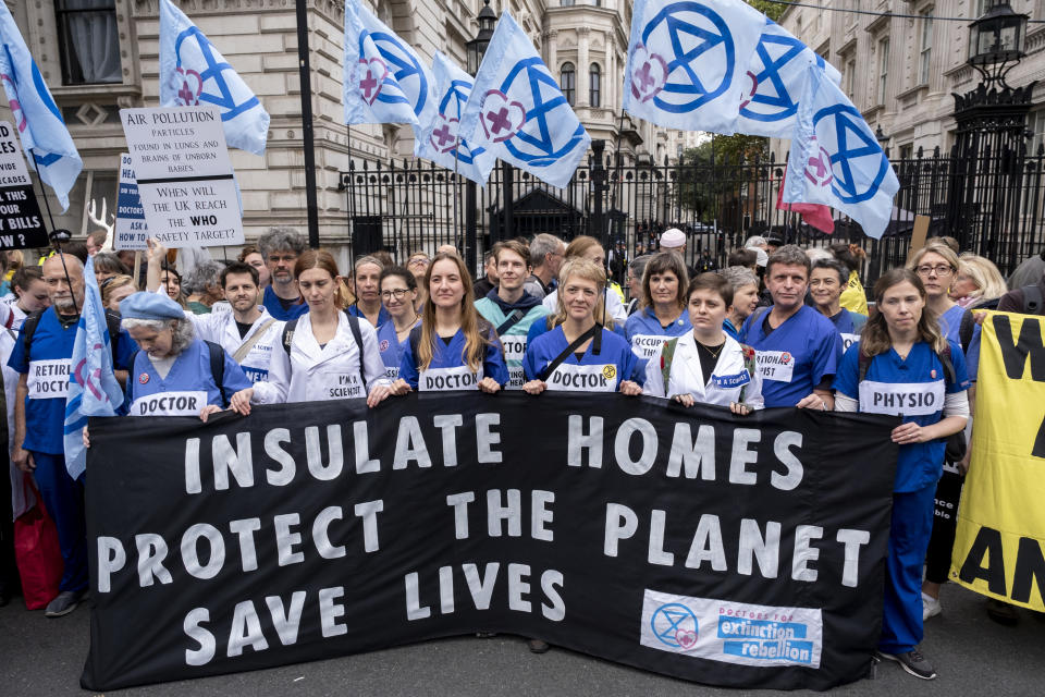 Protesters including doctors and health care professionals promoting the insulation of homes, join the Extinction Rebellion group as they bring thousands into Westminster to say We cant afford this anymore as they protest outside Downing Street on 14th October 2022 in London, United Kingdom. Extinction Rebellion is a climate change group started in 2018 and has gained a huge following of people committed to peaceful protests. These protests are highlighting that the government is not doing enough to avoid catastrophic climate change and to demand the government take radical action to save the planet. (photo by Mike Kemp/In Pictures via Getty Images)