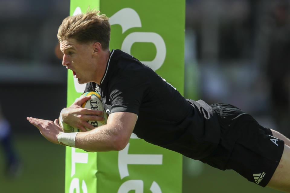 New Zealand's Jordie Barrett scores a try during the Rugby Championship game between the All Blacks and the Wallabies in Perth, Australia, Sunday, Sept. 5, 2021. (AP Photo/Gary Day)