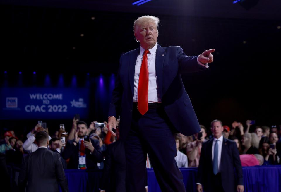 Former US President Donald Trump gestures during the Conservative Political Action Conference (CPAC) at The Rosen Shingle Creek on 26 February 2022 (Getty Images)