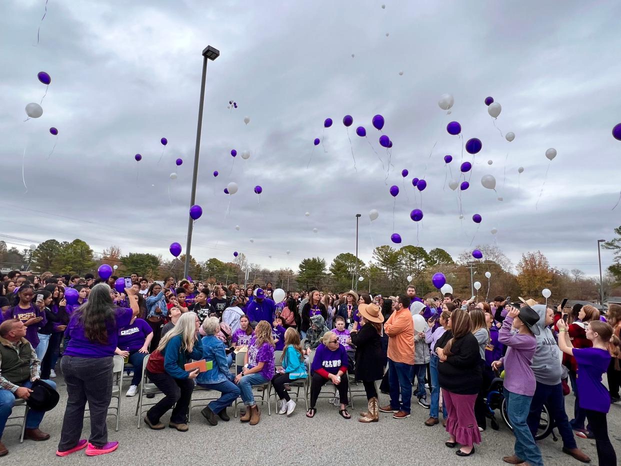 Students, friends and family of Will Spiess release balloons in his honor at Central High School on Friday, Nov. 17, 2023.