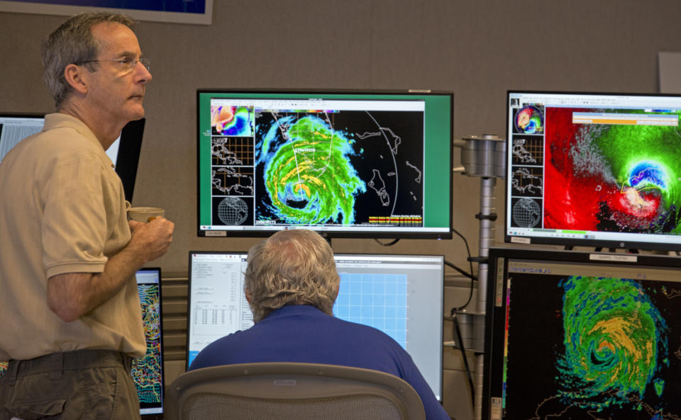 National Hurricane Center Acting Director Ed Rappaport, left, and Senior Hurricane Specialist Richard Pasch monitor Hurricane Irma Sunday, Sept. 10, 2017, at the National Hurricane Center in Miami. Forecasters declared the official landfall of Irma at 9:10 a.m. over Cudjoe Key, Fla. (Andy Newman/AP)