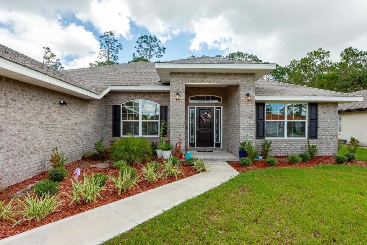 This immaculately built Palm Coast home features a private backyard that backs up to a small, freshwater canal.