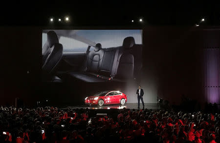 Tesla Chief Executive Elon Musk introduces one of the first Model 3 cars off the Fremont factory's production line during an event at the company's facilities in Fremont, California, U.S., July 28, 2017. REUTERS/Alexandria Sage