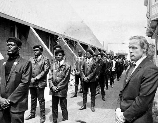 <p>By the late ’60s, the Panthers were not only target No. 1 of the FBI and the government — which tried every tactic at its disposal to destroy them, from informers and divide-and-conquer to arrests and all-out raids — they were also the darlings of the liberal white left. Celebs including actor Marlon Brando, above, composer and conductor Leonard Bernstein, and a young, shag-haired Jane Fonda (<a href="http://www.alamy.com/stock-photo-huey-newton-black-panther-party-minister-of-defense-@-news-confrence-32372549.html" rel="nofollow noopener" target="_blank" data-ylk="slk:here’s Huey Newton" class="link ">here’s Huey Newton</a> in her apartment in 1970) threw fundraisers for the Panthers in their posh New York City homes, leading to writer Tom Wolfe’s now-famous 1970 article in <i>New York </i>magazine, “<a href="http://nymag.com/news/features/46170/" rel="nofollow noopener" target="_blank" data-ylk="slk:Radical Chic" class="link ">Radical Chic</a>,” which viciously lampooned rich, white liberals for supporting black anticapitalist militants. (<i>Photo: Getty Images)</i></p>