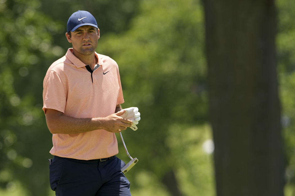 Scottie Scheffler walks off the green on the first hole during the first round of the PGA Championship golf tournament at Southern Hills Country Club, Thursday, May 19, 2022, in Tulsa, Okla. (AP Photo/Matt York)