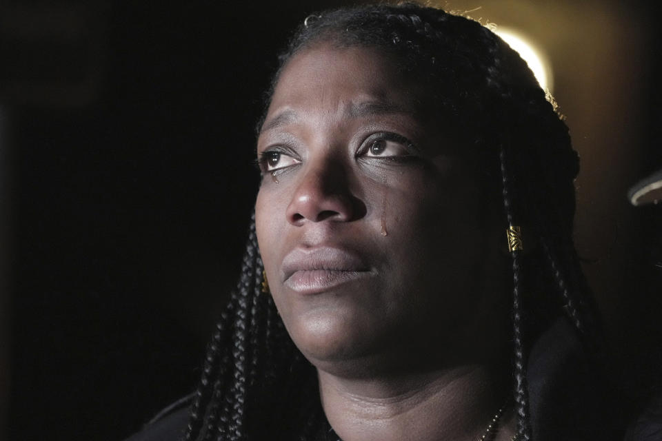 Keyana Dixon, sister of Tyre Nichols, weeps during a candlelight vigil for Nichols on the anniversary of his death Sunday, Jan. 7, 2024, in Memphis, Tenn. Nichols lost his life following a violent beating by five Memphis Police officers in January 2023. (AP Photo/Karen Pulfer Focht)