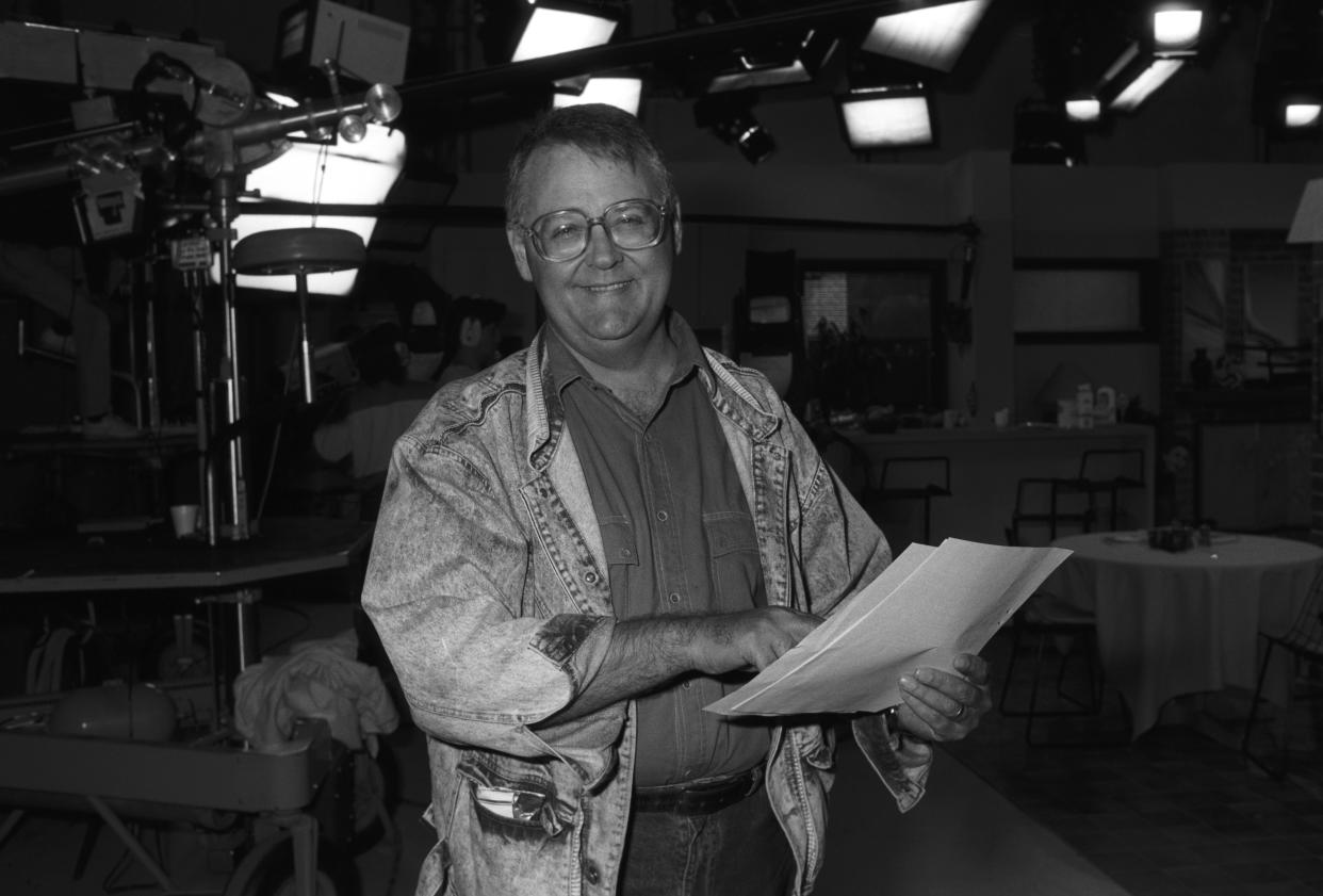 Ian Smith, actor, as Harold Bishop in Australian soap opera Neighbours smiling while holding a script. Australia, 20th October 1988. (Photo by Express Newspapers/Getty Images)