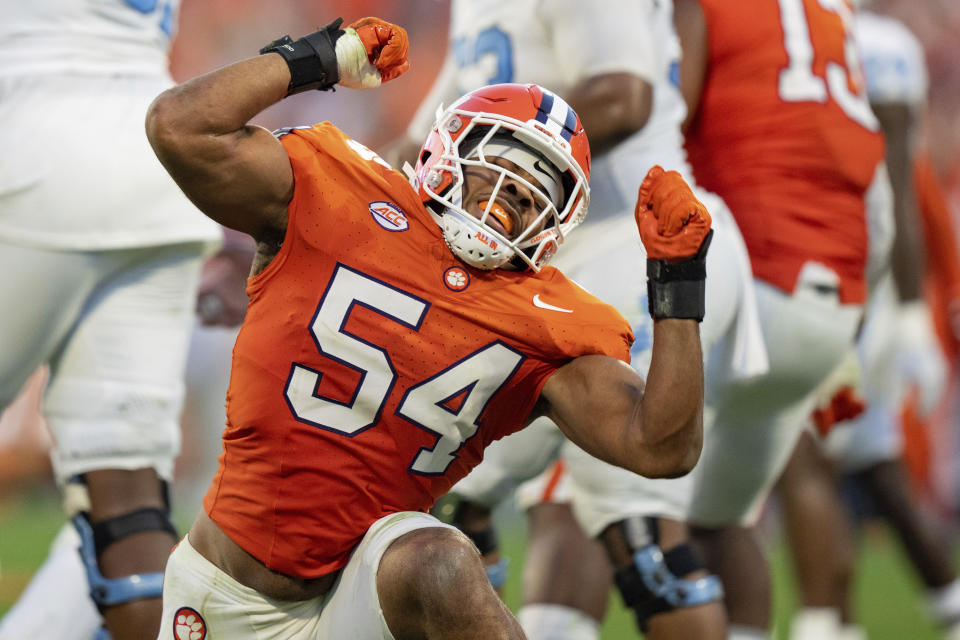 FILE - Clemson linebacker Jeremiah Trotter Jr. (54) reacts during an NCAA college football game against North Carolina Saturday, Nov. 18, 2023, in Clemson, S.C. Jeremiah Trotter Jr. wears his dad’s No. 54, plays the same position and celebrates sacks and big tackles with the same signature axe swing. (AP Photo/Jacob Kupferman, File)