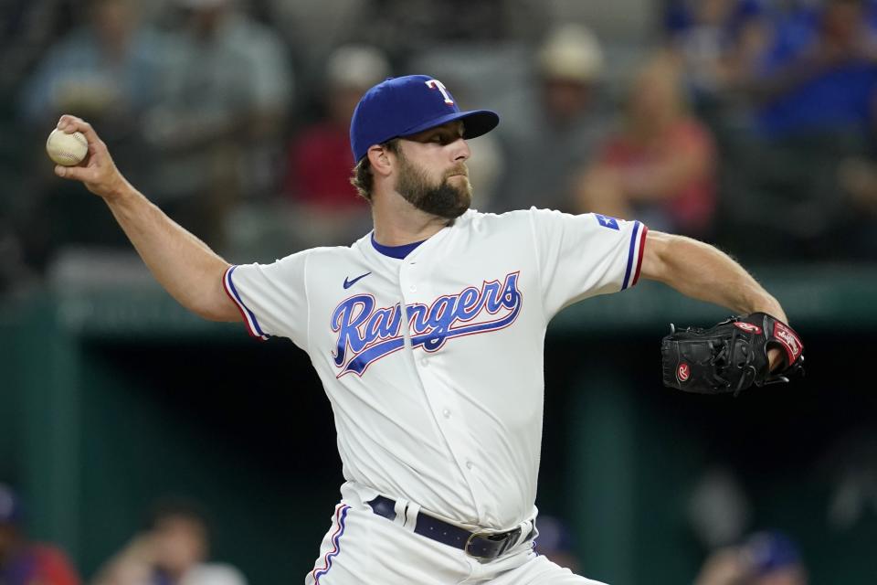 Texas Rangers starting pitcher Jordan Lyles throws during the first inning of the team's baseball game against the Houston Astros in Arlington, Texas, Tuesday, Sept. 14, 2021. (AP Photo/Tony Gutierrez)