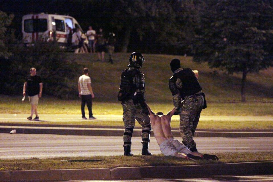 Riot police detain a protester after polls closed in the presidential election, in Minsk on Aug. 9, 2020. (Siarhei Leskiec/AFP via Getty Images)