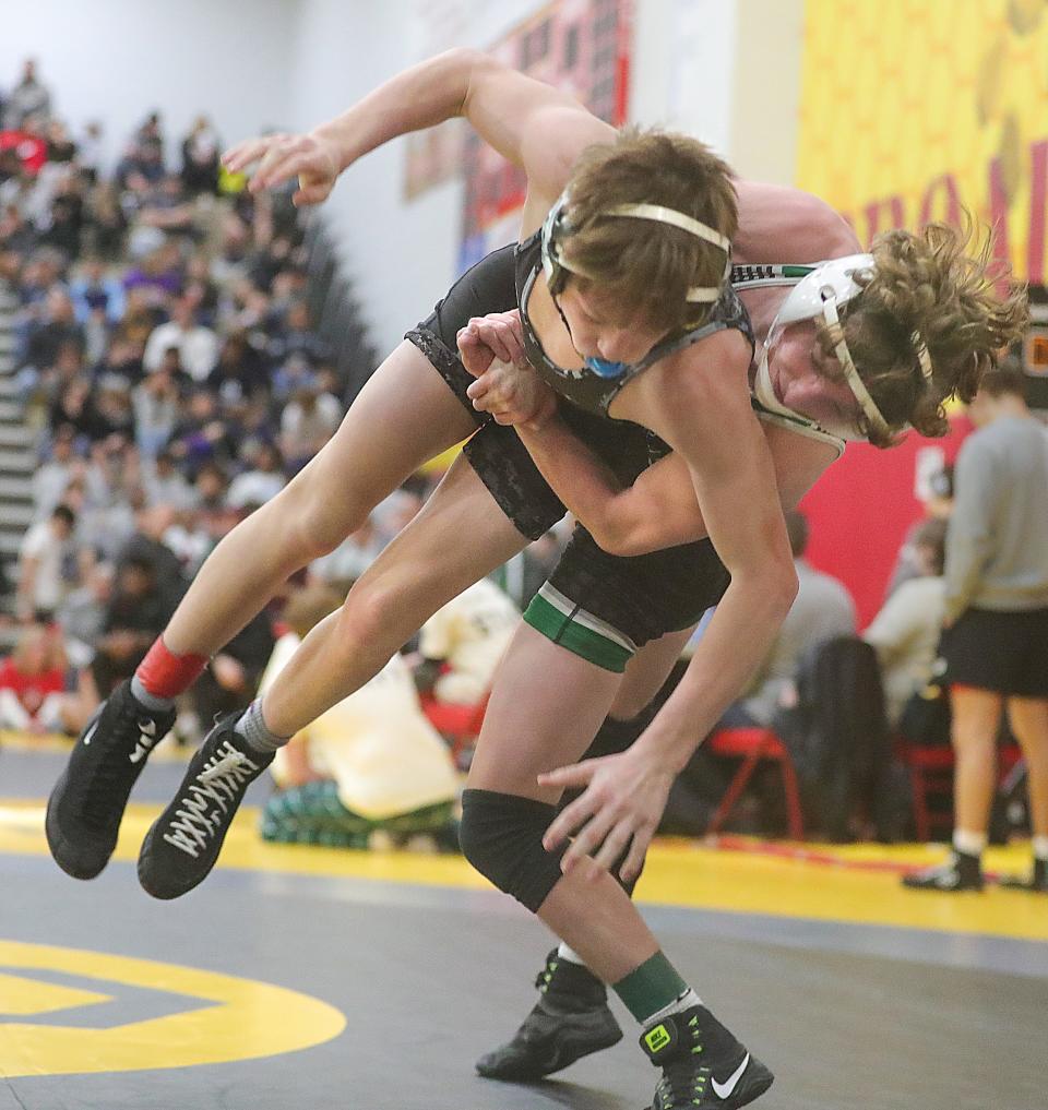 Aurora 113-pounder Johnny Green, right, takes down Tommy Slack of Lake Catholic in the Brecksville Holiday Tournament, Friday, Dec. 29, 2023.