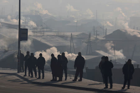 People wait for the bus on a cold polluted day in Ulaanbaatar, Mongolia January 19, 2017. REUTERS/B. Rentsendorj