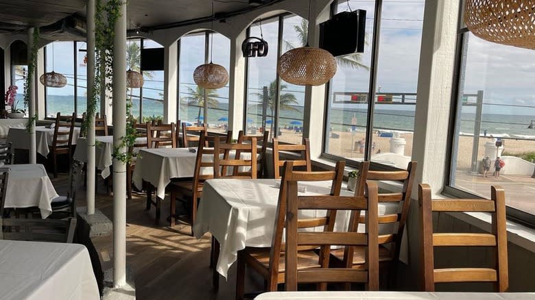 White tables with beach background