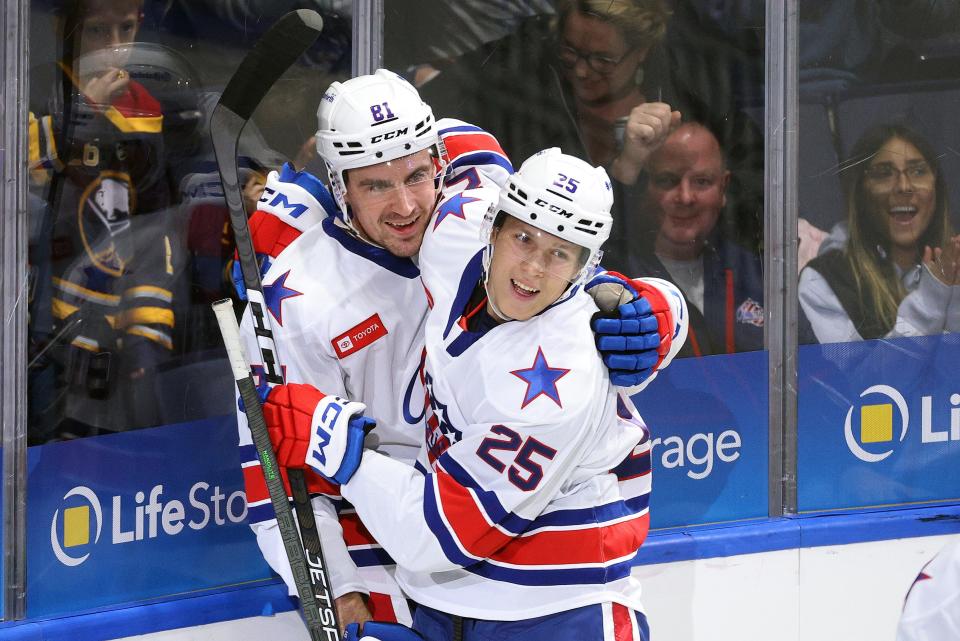 Amerks Brett Murray is congratulated by teammate Jiri Kulich (25) after Murray's goal.