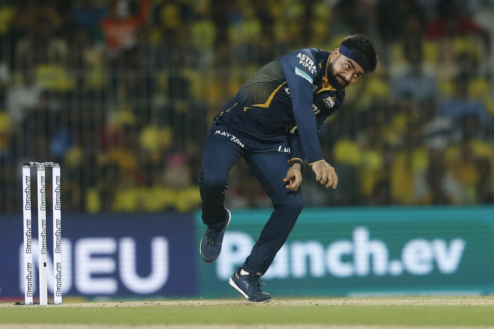 Gujarat Titans' Rashid Khan bowls a delivery during the Indian Premier League cricket tournament between between Chennai Super Kings and Gujarat Titans, in Chennai, India, Tuesday, March 26, 2024. (AP Photo/R. Parthibhan)