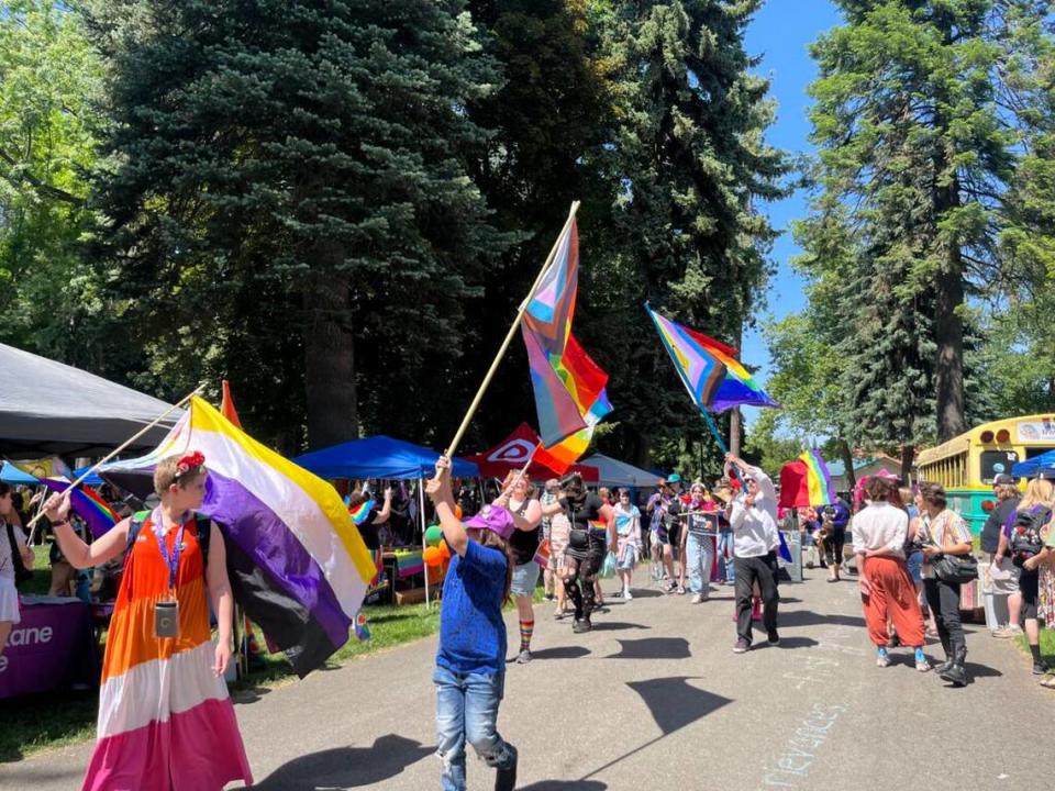 A parade takes place Saturday at City Park in downtown Coeur d’ Alene during the Pride in the Park event.