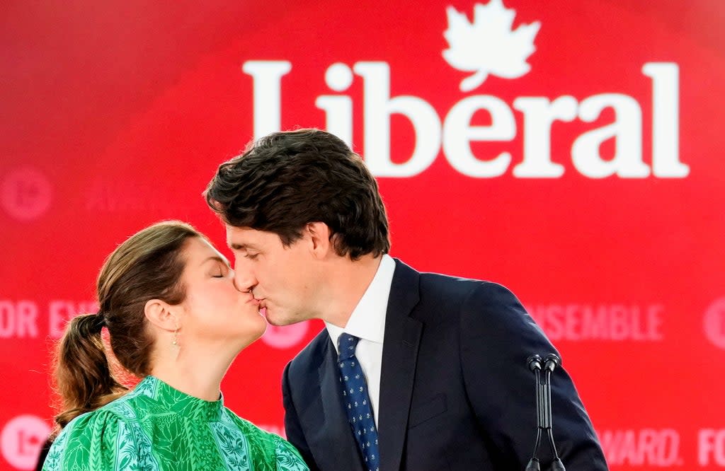 Justin Trudeau kisses his wife Sophie Gregoire during the Liberal election night party in Montreal (REUTERS)