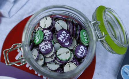 'No Thanks' badges are displayed during campaigning by Alistair Darling, the leader of the campaign to keep Scotland part of the United Kingdom, in Edinburgh, Scotland September 8, 2014. REUTERS/Russell Cheyne