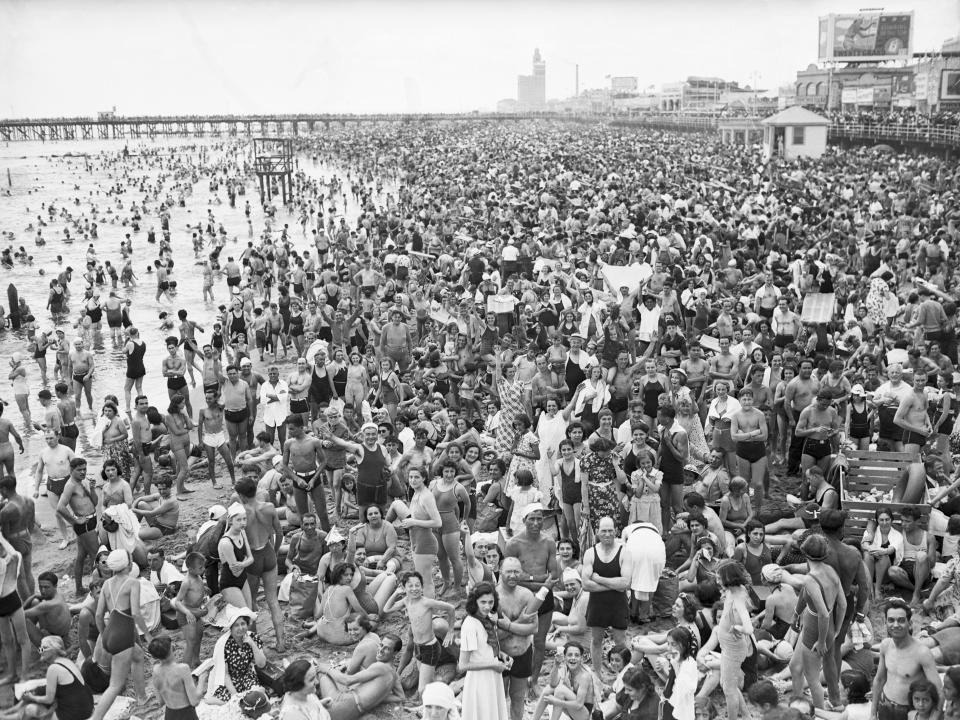 People crowding the beach at Coney Island on July 4, 1938