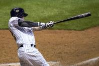 Milwaukee Brewers' Eric Sogard hits a walk off two-run home run during the ninth inning of a baseball game against the Pittsburgh Pirates Saturday, Aug. 29, 2020, in Milwaukee. The Brewers won 7-6. (AP Photo/Morry Gash)